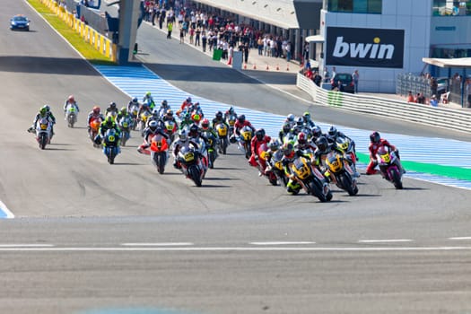 JEREZ DE LA FRONTERA, SPAIN - APR 17: Motorbike competitors begin the Moto2 race in the CEV Championship on April 17, 2011 in Jerez de la Frontera, Spain.