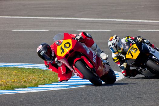 JEREZ DE LA FRONTERA, SPAIN - APR 17: Moto2 motorcyclist Roman Ramos and Tomoyoshi Koyama takes a curve in the CEV Championship race on April 17, 2011 in Jerez de la Frontera, Spain.