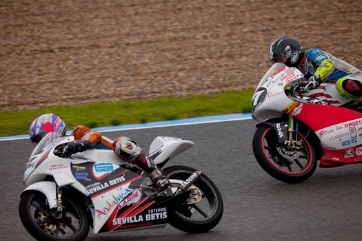JEREZ DE LA FRONTERA, SPAIN - NOV 20: Pilots Manuel Tatasciore and  Cristobal Tejero of motorcycling of 125cc in the Spanish championship of velocity (CEV) on Nov 20, 2010, in racetrack of velocity of Jerez de la Frontera