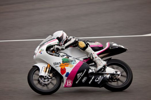 JEREZ DE LA FRONTERA, SPAIN - NOV 20: Miguel Poyatos Alarcon pilot of motorcycling of 125cc in the Spanish championship of velocity (CEV) on Nov 20, 2010, in racetrack of velocity of Jerez de la Frontera