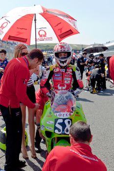 JEREZ DE LA FRONTERA, SPAIN - APR 17: 125cc motorcyclist Juanfran Guevara waiting on the starting gates in the CEV Championship race on April 17, 2011 in Jerez de la Frontera, Spain.