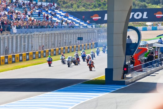JEREZ DE LA FRONTERA, SPAIN - APR 17: Motorbike competitors begin the uneven 125cc race in the CEV Championship on April 17, 2011 in Jerez de la Frontera, Spain.