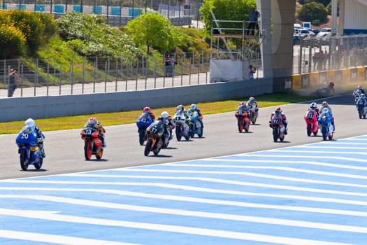 JEREZ DE LA FRONTERA, SPAIN - APR 17: Motorbike competitors begin the uneven 125cc race in the CEV Championship on April 17, 2011 in Jerez de la Frontera, Spain.
