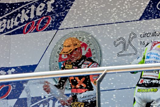JEREZ DE LA FRONTERA, SPAIN - APR 17: Alex Rins pilot of motorcycling of 125CC on the podium like winner of the race on the CEV Championship on April 17, 2011, in Jerez de la Frontera