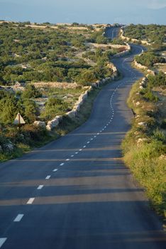 Asphalt winding road, Island of Pag, Croatia.