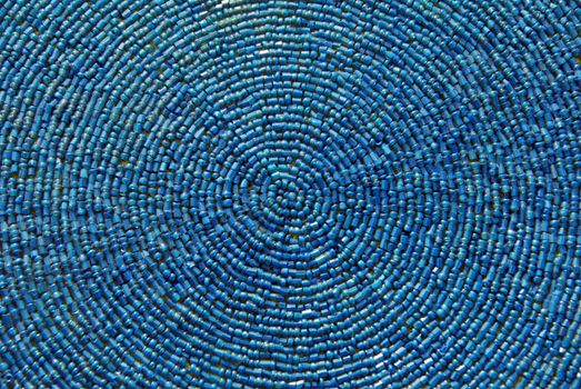 Indian fabric design with blue beads texture 