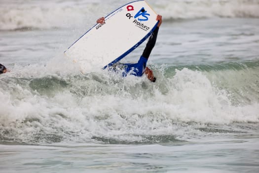 SAN FERNANDO, CADIZ, SPAIN - FEB 19: Unknown bodyboader on the 2nd championship of Surf and BodyBoard Impoxibol on Feb 19,2011 on the beach of Camposoto of San Fernando, Cadiz, Spain