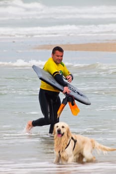 SAN FERNANDO, CADIZ, SPAIN - FEB 19: Unknown bodyboader on the 2nd championship of Surf and BodyBoard Impoxibol on Feb 19,2011 on the beach of Camposoto of San Fernando, Cadiz, Spain