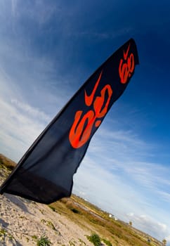 SAN FERNANDO, CADIZ, SPAIN - FEB 19: Flag of the 2nd championship of Surf and BodyBoard Impoxibol on Feb 19,2011 on the beach of Camposoto of San Fernando, Cadiz, Spain