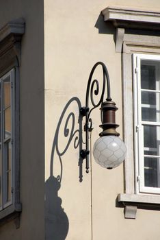 architecture detail, street lamp and a shadow  in Trieste, Italy