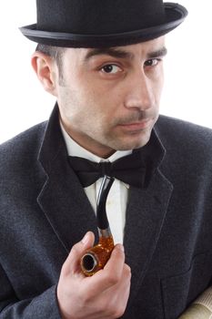 Portrait of a man with a tobacco pipe and hat bowler 