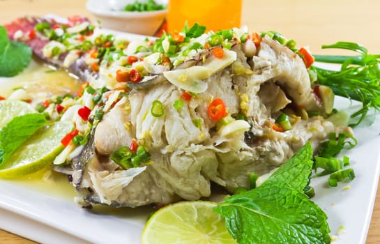 Spicy steamed fish fillet with chopped chillis healthy food