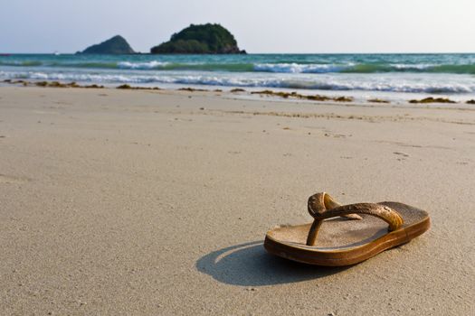 Sandals, flip-flops on the beach