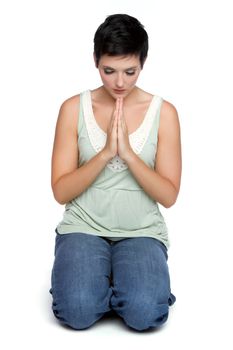 Isolated young spiritual woman praying