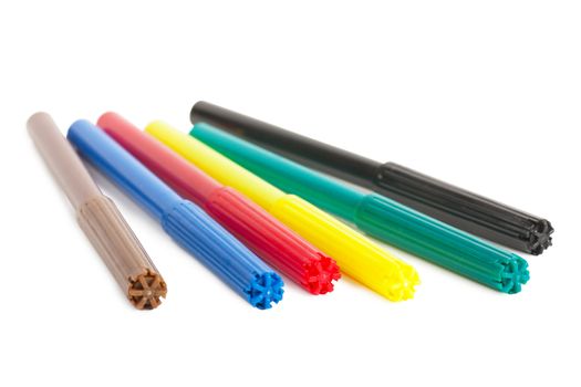 Six colorful markers (brown, blue, red, yellow, green and black) over white background