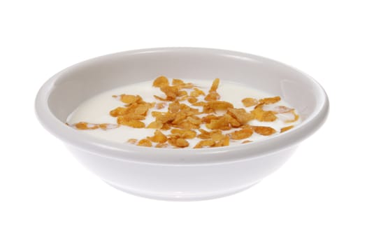 Bowl with corn flakes and milk, photo on white