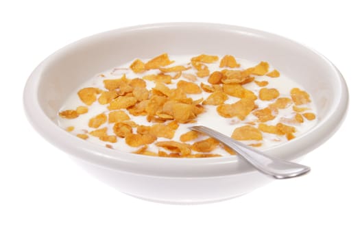 Bowl with corn flakes and milk, photo on white