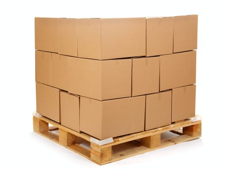 cardboard boxes on wooden palette, isolated on white