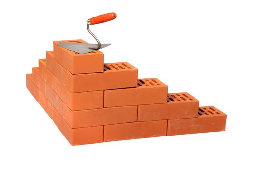 red bricks and trowel, photo on the white background