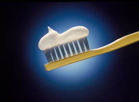 close-up of toothbrush and toothpaste