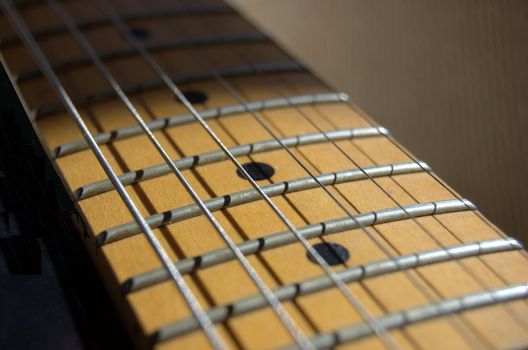 Closeup of electric guitar frets