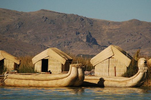 Reef boats  and houses on reef island on Titicaca lake, Bolivia Peru