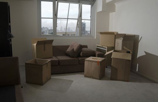 unpacking boxes after moving into a new apartment