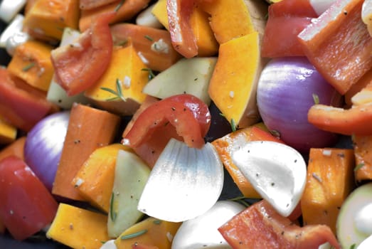 a tray of colourful vegetables ready for roasting