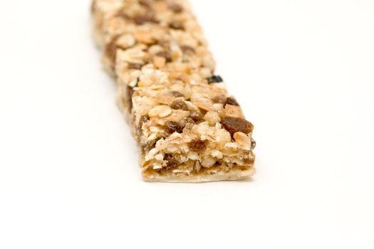 fitness bar with raisins on neutral background