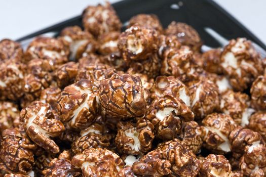 brown color chocolate popcorn on neutral background