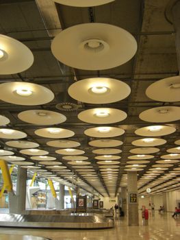 lamps on the ceiling of an airport hall, symbol for vastness and freedom