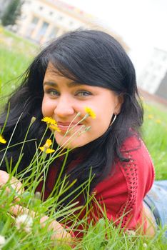 lovely female model.beautiful girl lying down of grass.