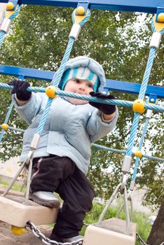 Boy Playing at the Playground.Jumping at the Playground