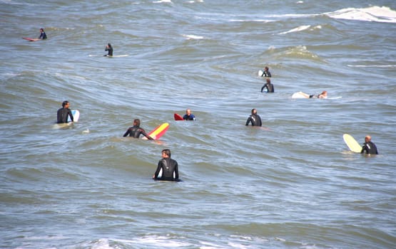 Scheveningen Surf Competition - August 23, 2008. Surfers at sea waiting for a wave