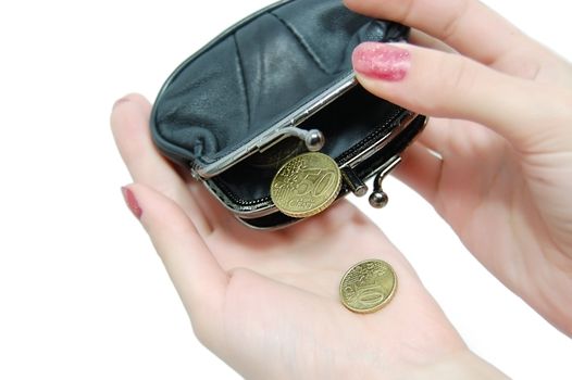 Female hands holding leather purse and falling coins