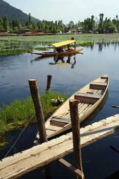 Water taxi in Kashmir, India taking passengers to their houseboat.
