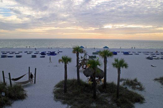 A sunset across a beach and ocean.