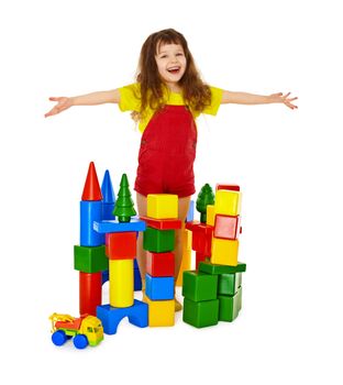 Happy child in a toy castle isolated on white background