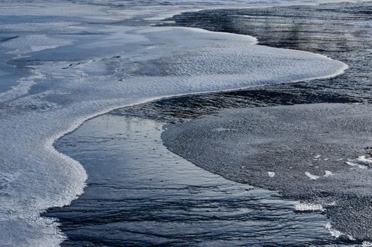 Ice and a runoff stream in autumn, Midway Geyser Basin, Yellowstone National Park, Wyoming, USA