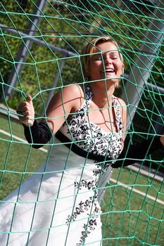 The pretty bride is catched by the net