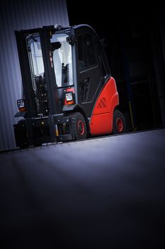 the red forklift in a logistic warehouse with