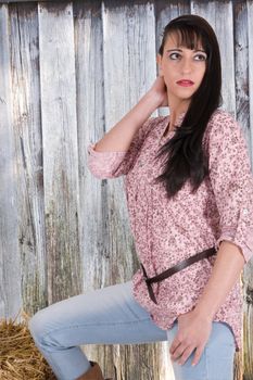 Girls in Western clothing from a wooden shed