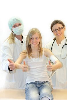 Doctor, nurse and girls keep the thumbs up - all smile 
