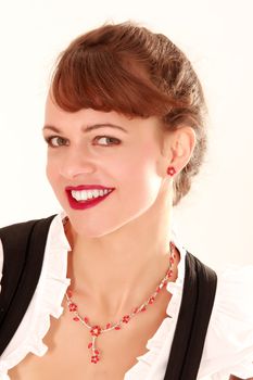 Portrait of a smiling beauty in Bavarian costume