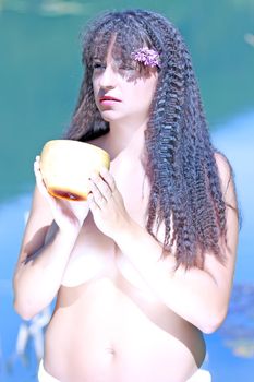 Young woman in Hawaiian style topless