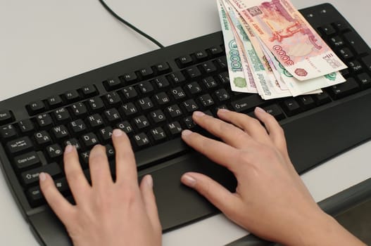  russian currency and hands on  keypad 