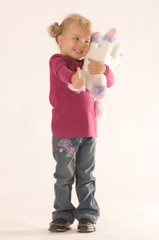 Girl with stuffed animal is thinking positive