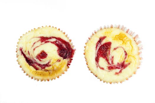 Muffine sized cheesecakes isolated on white and viewed from directly above.