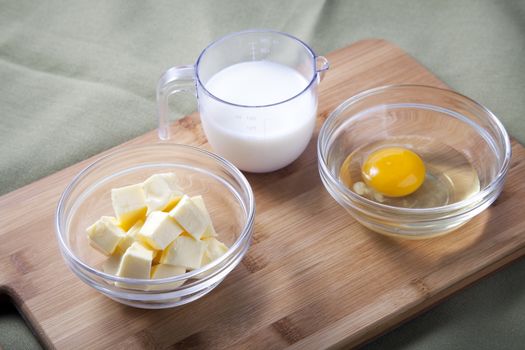 Fresh milk, butter and eggs;  ingredients    for baking.