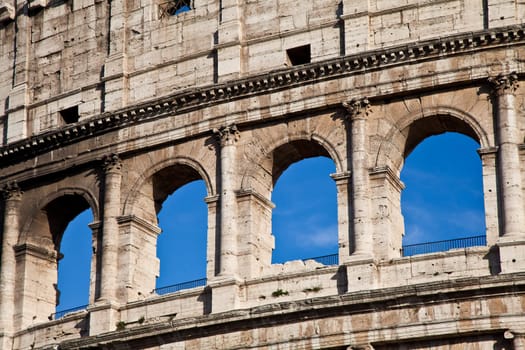 Colosseum in Rome with blue sky, landmark of the city